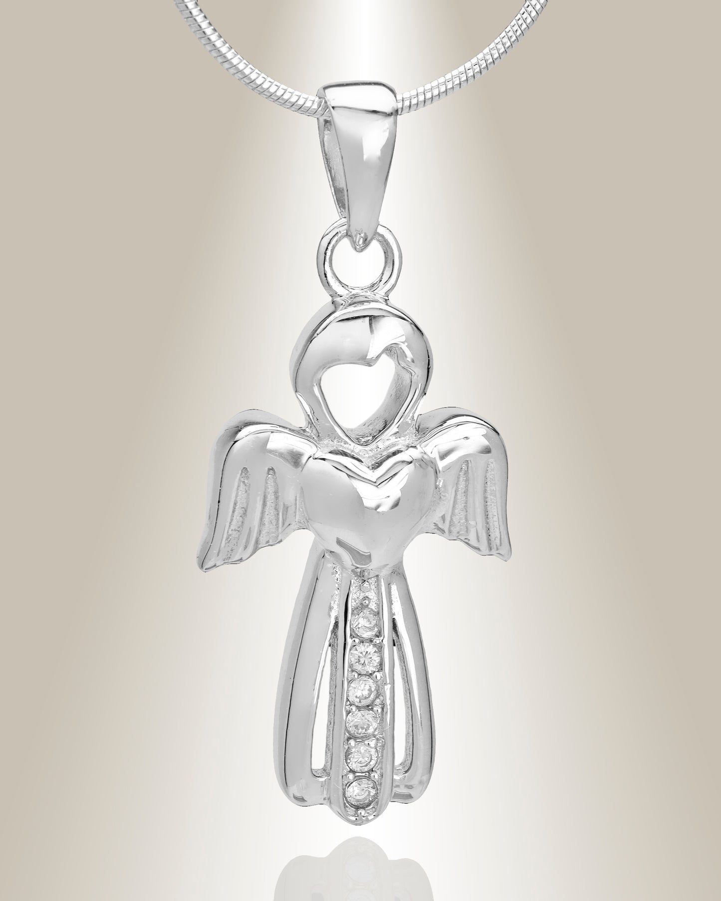 A silver angel-shaped cremation pendant with small gemstone accents, suspended from a silver chain.