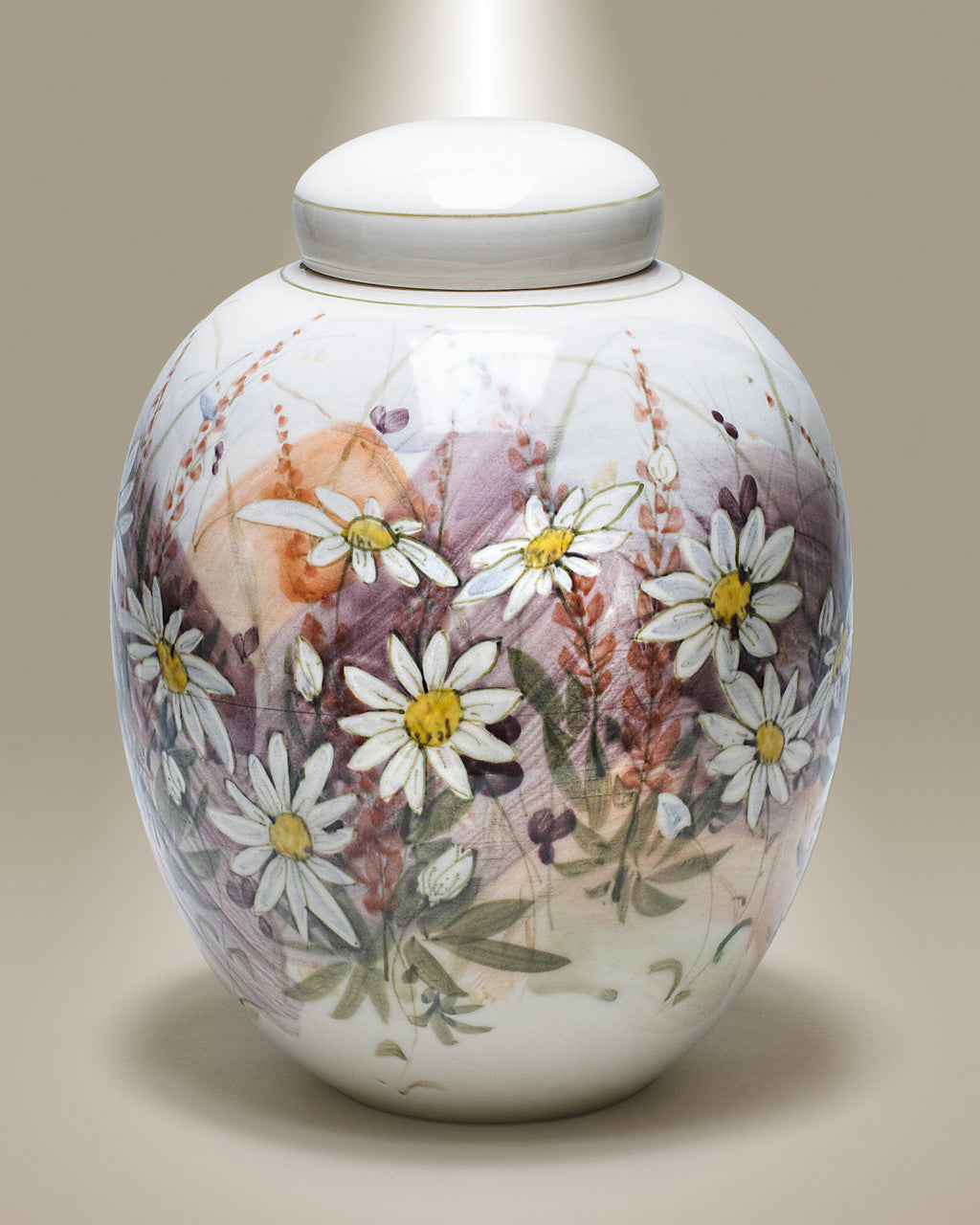 A handmade ceramic cremation urn with a floral pattern, featuring daisies in white, pink, and purple hues on a light background.