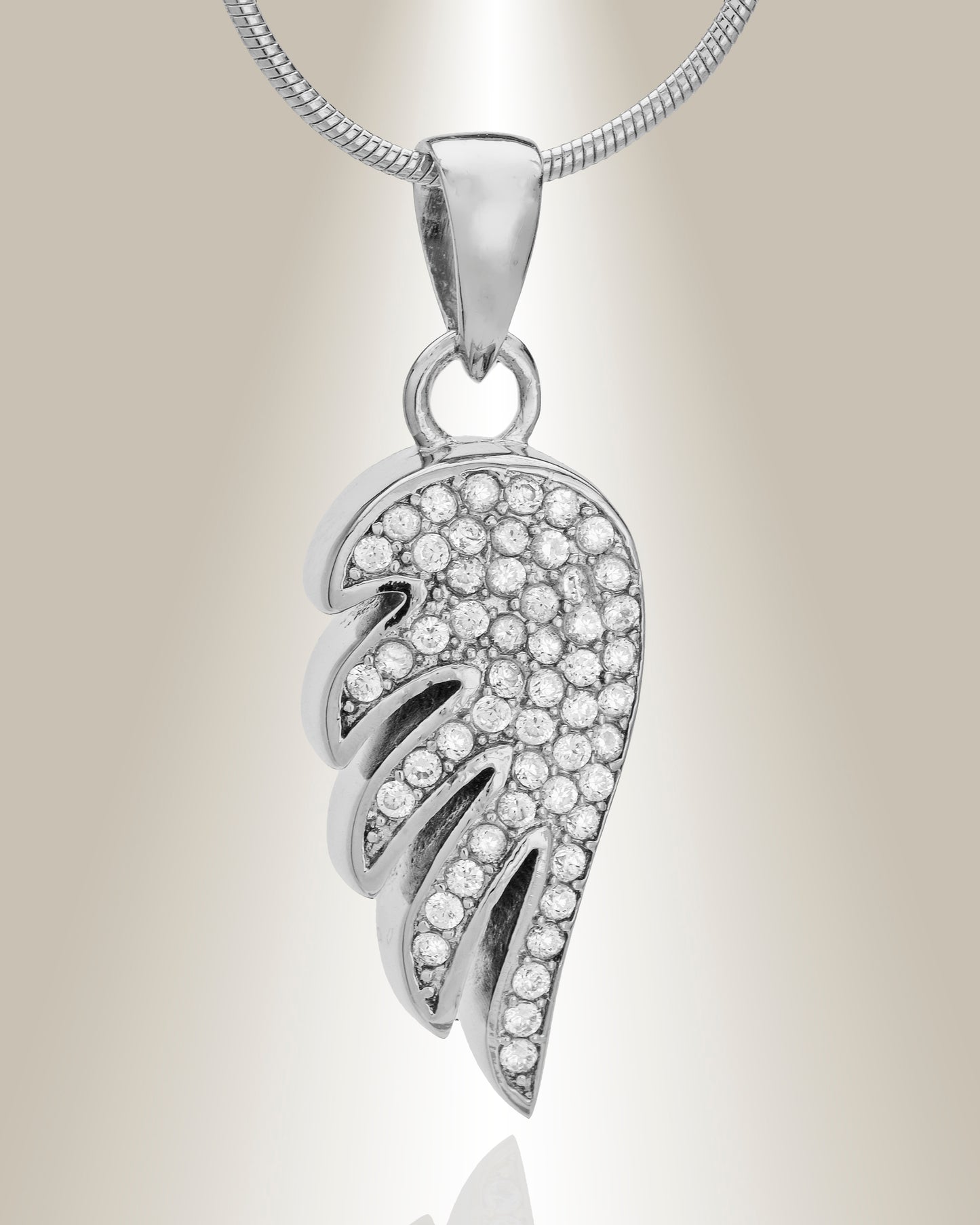 Angel wing shaped cremation pendant made of sterling silver with gemstone accents, displayed with an included matching 20" chain.