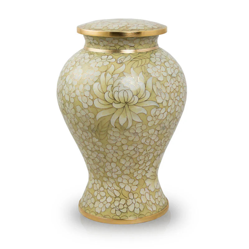 A gold floral urn with a threaded lid, featuring a contemporary design with ancient artistic techniques.