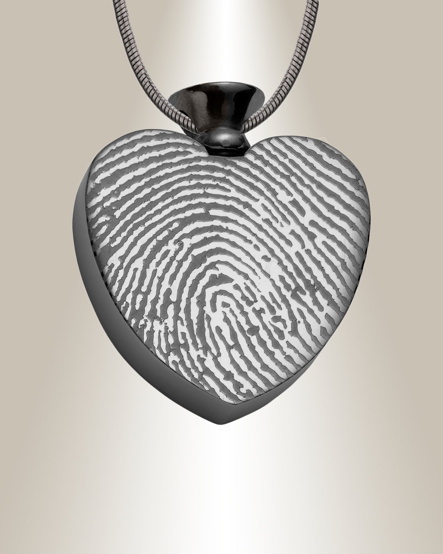 A stainless steel heart-shaped pendant with a fingerprint engraving in the center, available in gold, rose gold, and silver colors, displayed with a 20-inch chain.