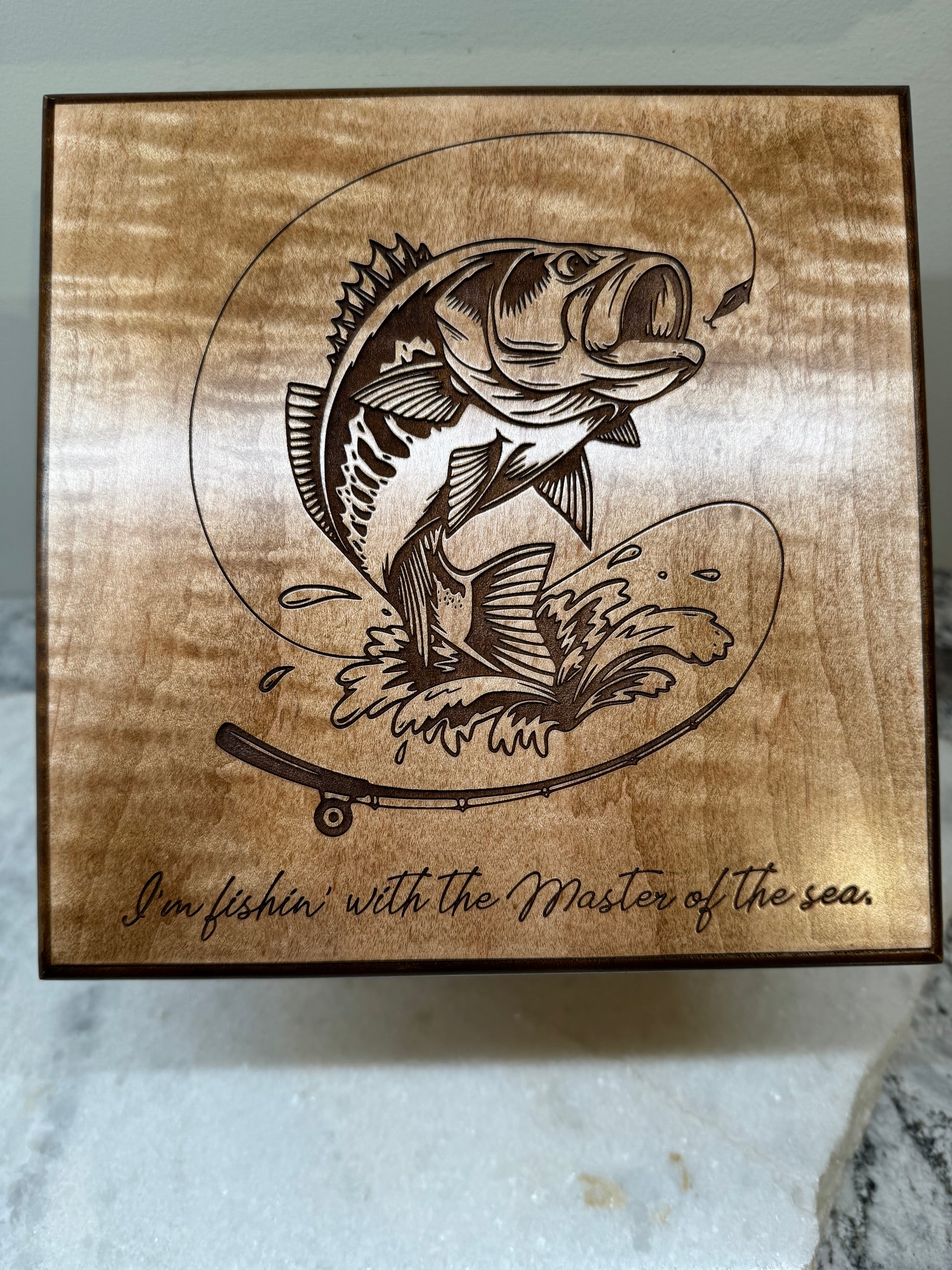 Personalized fishing-themed memorial urn with the quote "I'm fishin' with the Master of the sea."