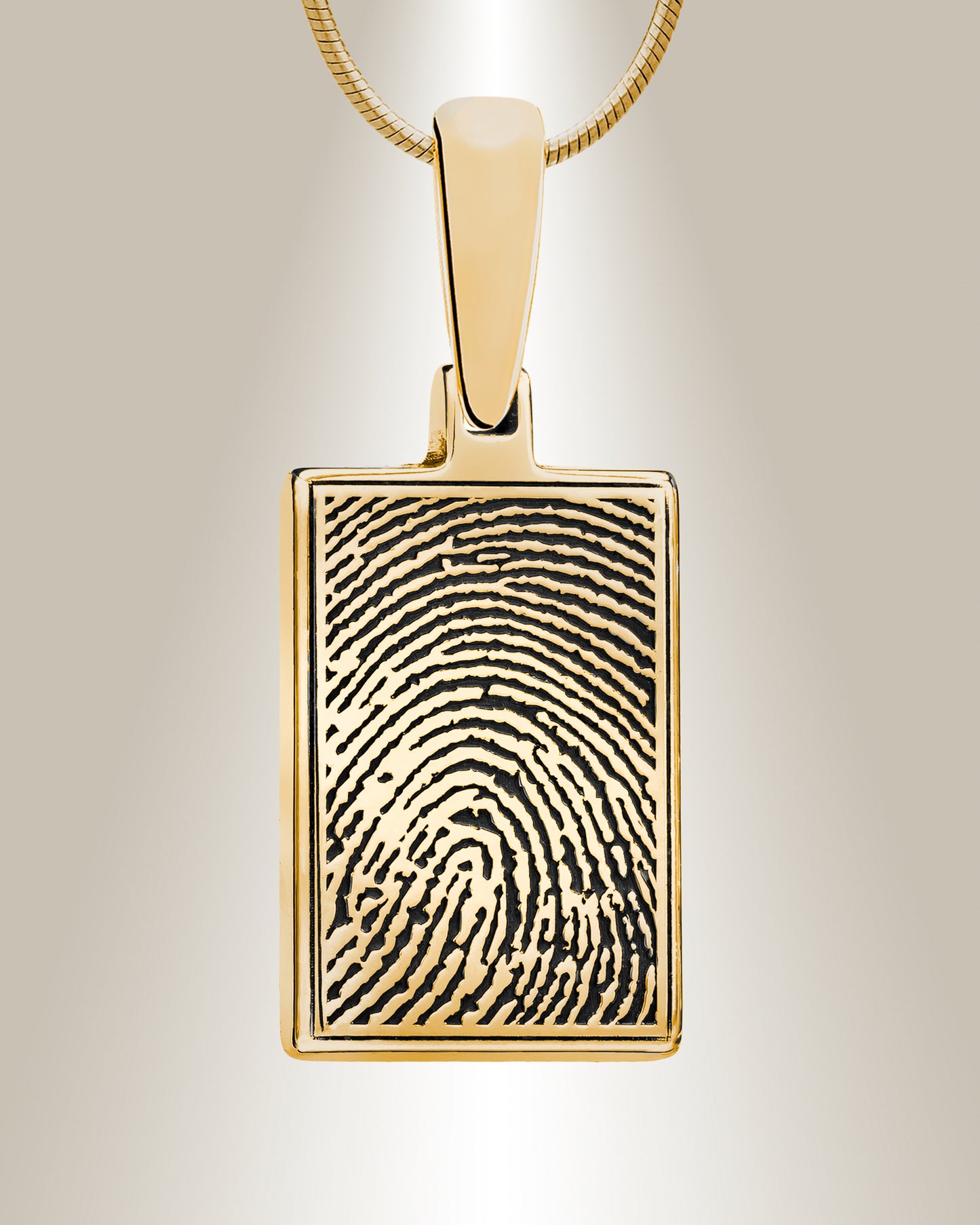 A rectangular fingerprint pendant with a gold frame on a chain, the fingerprint is engraved in high definition on the front face.