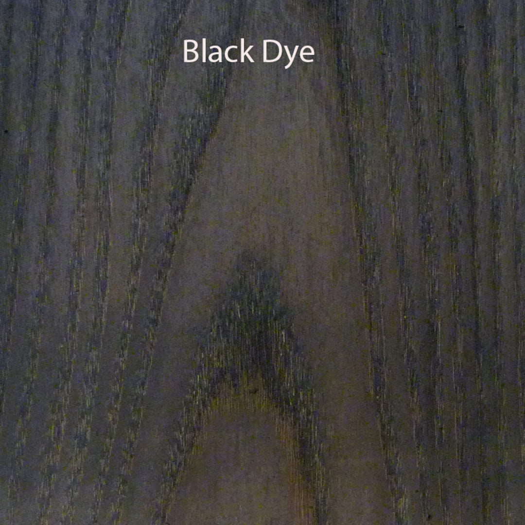 Close-up of black dye on a wood surface with 'Black Dye' text.