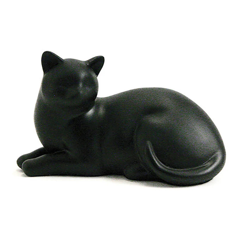 A handcrafted black resin cat-shaped cremation urn