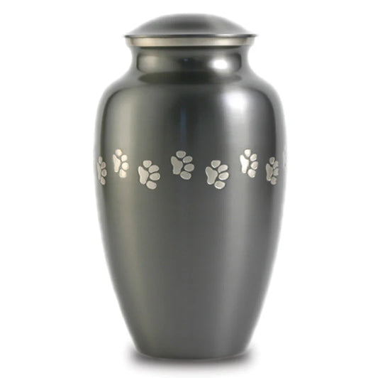 A large, gray pet urn with paw print accents.