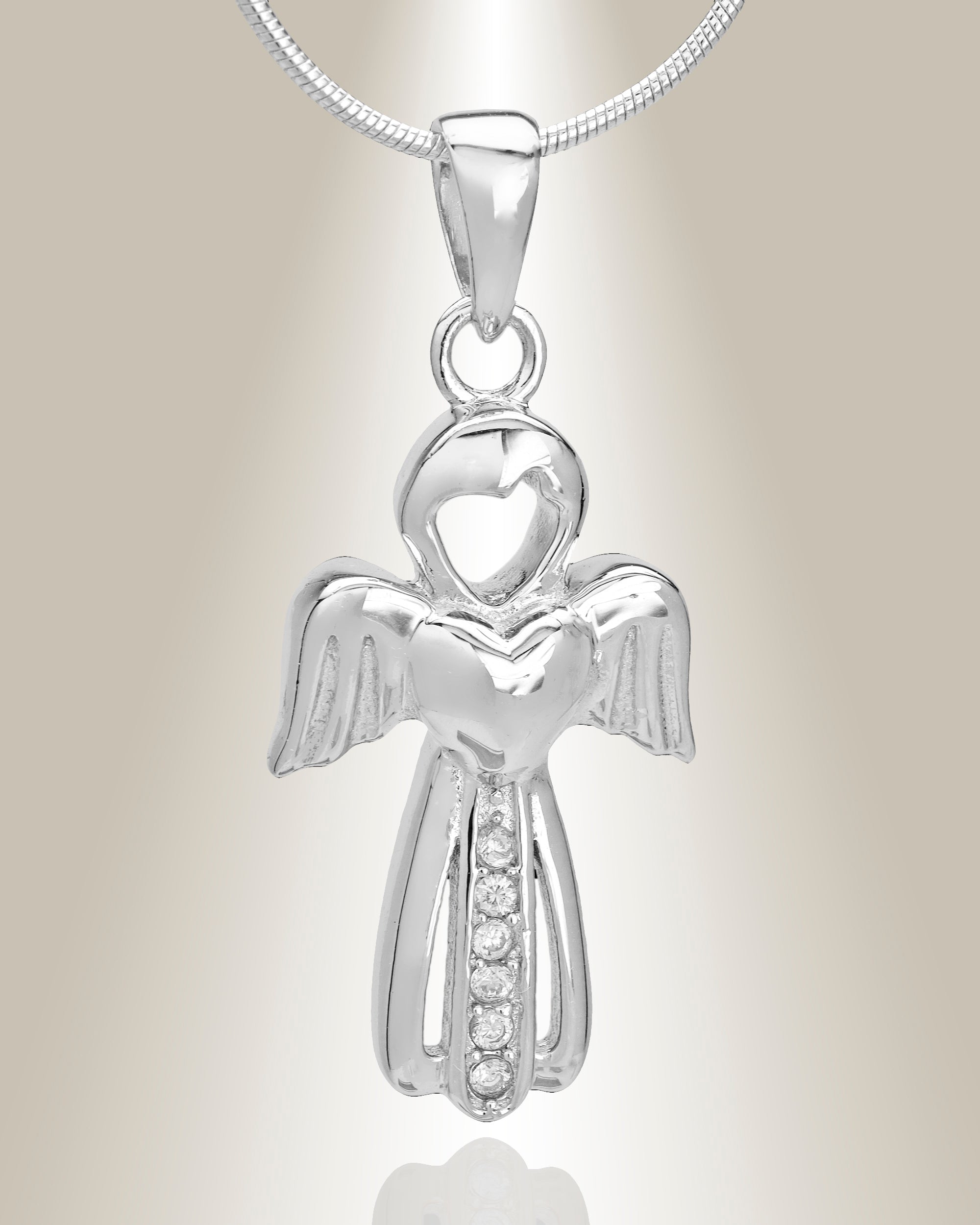A silver angel-shaped cremation pendant with small gemstone accents, suspended from a silver chain.