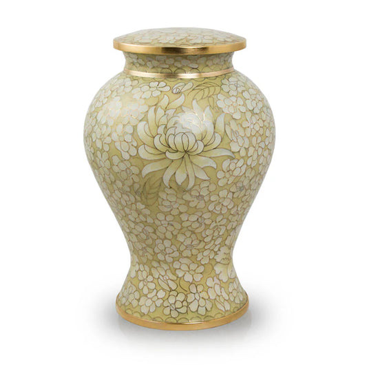 A gold floral urn with a threaded lid, featuring a contemporary design with ancient artistic techniques.