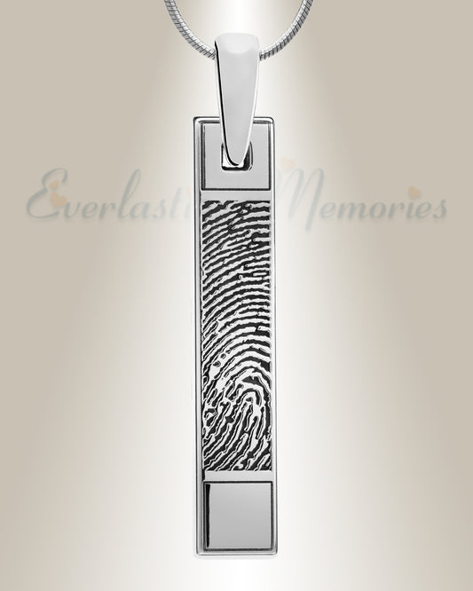 A long bar fingerprint pendant made of sterling silver with a raised platform at the top and bottom, featuring an engraved fingerprint in the center.