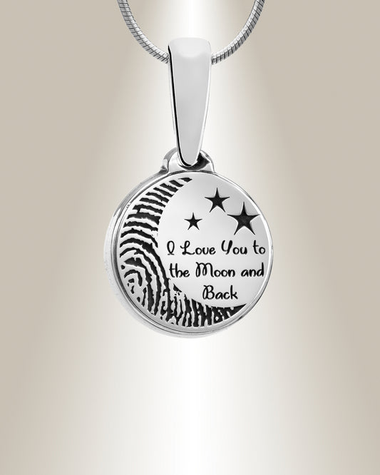 A sterling silver round pendant with an engraved fingerprint shape and the phrase 'I love you to the moon and back', accompanied by a matching 20" chain.