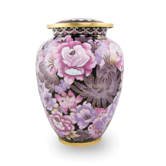 A large cloisonne urn with a traditional Chinese floral motif in shades of pink, featuring a gold or silver engraved hanging oval pendant.