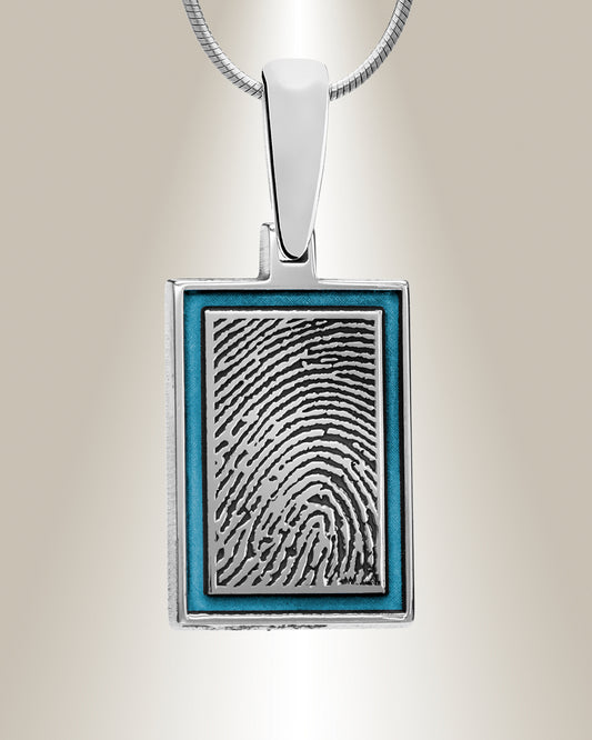 A rectangular color-filled fingerprint pendant made of sterling silver with a laser engraved fingerprint image in the center, surrounded by a blue color-filled frame.