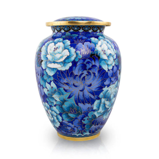 A large Cloisonne cremation urn with a traditional Chinese floral motif in shades of blue, featuring a gold or silver engraved hanging oval pendant on the lid.