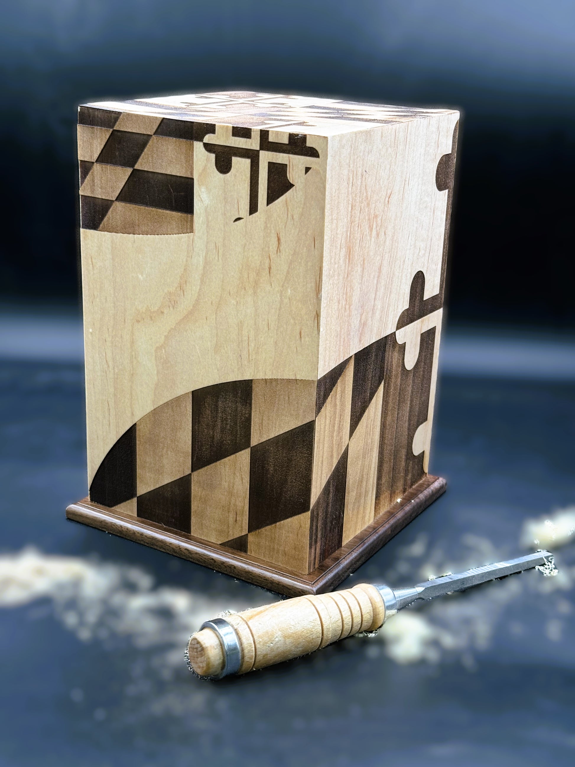 Custom wood memorial urn featuring a stylized, wrap-around Maryland flag laser engraving.